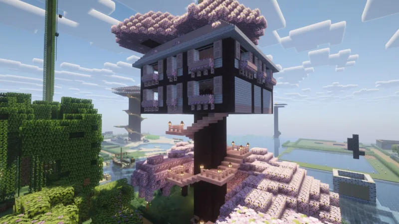Дом на высокой опоре среди сакуры с лестницами и фонарями в Minecraft