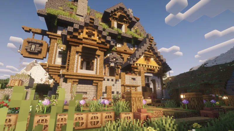 Средневековый дом в Minecraft из камня и дерева с садом и цветами