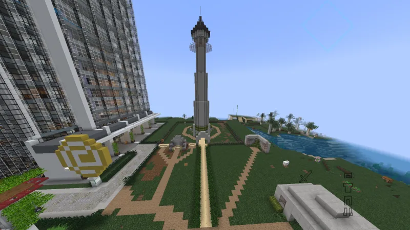 Высокая серая башня-монумент в Minecraft с парком и дорожками вокруг