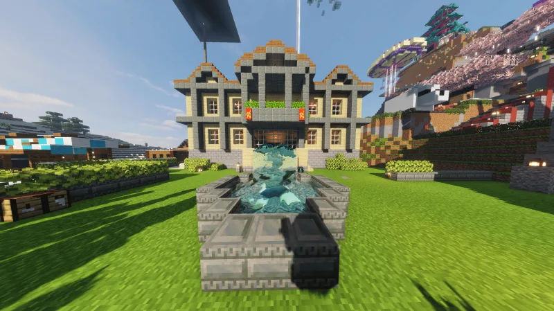 Особняк cs_mansion с фонтаном и красными флагами в Minecraft