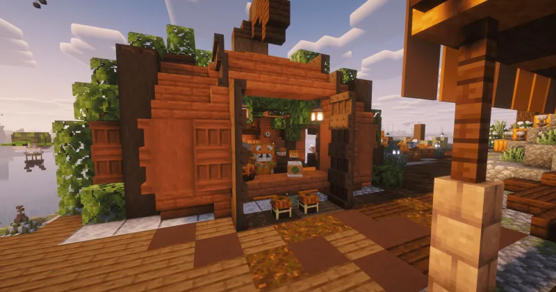 Тыквенное кафе Pumpy's в Minecraft из акации с оранжевым декором